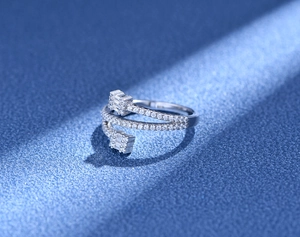Detailed view of S925 silver triple-layered open ring with micro-paved cubic zirconia
