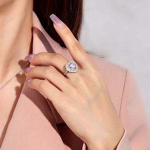 925 silver ring featuring a 7mm heart-shaped pink diamond-like center stone on a hand