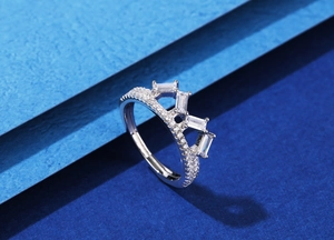 Detail view of the crown-shaped silver ring featuring rectangular baguette-cut cubic zirconia