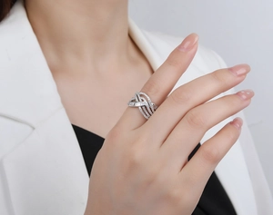 Close-up of S925 sterling silver multi-layer woven ring with shimmering pavé diamonds