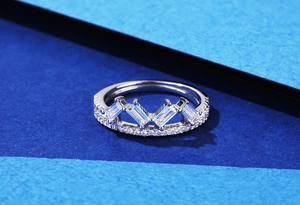 Macro detail of crown ring with baguette cut cubic zirconia and pavé setting