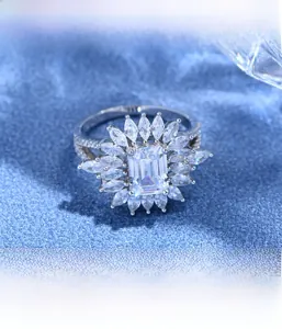 Detailed view of Asscher cut main stone and floral marquise halo setting on silver ring