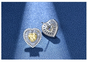 Detail of 925 silver heart stud earrings featuring yellow gems and crystal halo