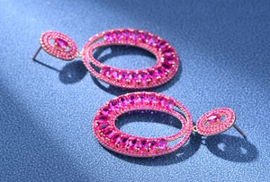 Macro detail of luxurious S925 silver pink tourmaline double hoop earrings in rose gold