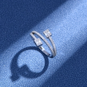 Three-layer silver open ring with dual emerald-cut stones and crystal pavé setting
