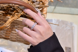 Detailed view of S925 sterling silver baguette-cut full eternity ring on hand