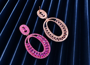 Detail view of pink tourmaline earrings showing rose gold plated hollow back and front gems