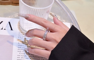 Close-up of a S925 sterling silver eternity band with baguette cut cubic zirconia