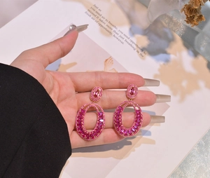 Macro shot of oval pink tourmaline drop earrings in rose gold s925 silver setting