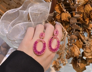 Detailed close-up of S925 silver pink tourmaline oval drop earrings with rose gold plating