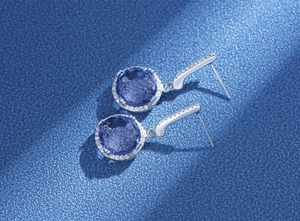 Macro side view of 11mm round blue gemstone drop earrings in S925 sterling silver