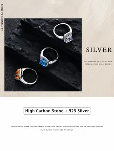 Macro shot of three 925 silver rings with square cut gemstones on black stones