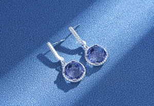 Macro shot of 11mm round sapphire cubic zirconia earrings with halo micro-pave in S925 silver