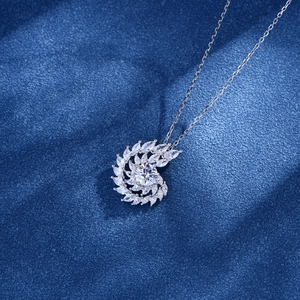 Sparkling S925 silver spiral necklace with marquise cut stones on a textured navy background
