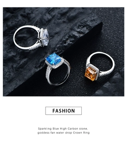 Macro detail of three 925 silver rings with square cut colorful radiant carbon stones