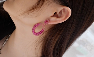Close-up of luxury pink tourmaline earrings in rose gold plated sterling silver