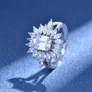 Luxurious 925 sterling silver ring with emerald cut center stone and marquise halo detail