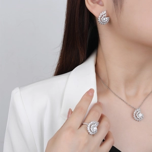 Elegant silver whirlpool crystal jewelry set with necklace earrings and ring on model