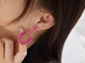 Close-up of luxury S925 silver rose gold earrings with pink marquise zircon stones