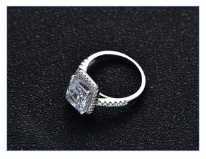 Top view of radiant cut 925 silver halo ring with large 7ct square moissanite stone