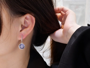 Close-up of 11mm round purple crystal drop earrings with S925 silver pave detailing