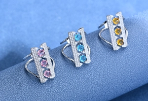 Three 925 silver arch rings with colorful stones in pink, blue, and yellow gemstone set