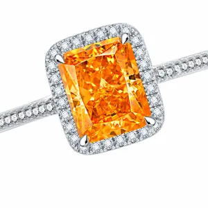 Macro shot of 7ct radiant cut orange carbon diamond ring with silver micro-pave details