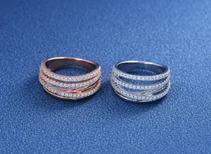Macro detail of S925 engraved stamp and pave zircons on multi-layer rose gold ring