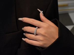 Close-up of eternity ring with sparkling cubic zirconia on a model finger