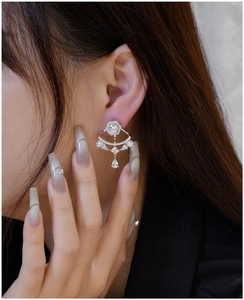 Detail of S925 silver ear jacket with fan-shaped zirconia clusters on a model