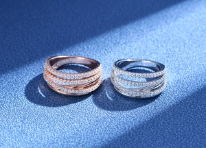 Detailed close-up of S925 silver wide band rings with pave diamonds and 18k rose gold finish