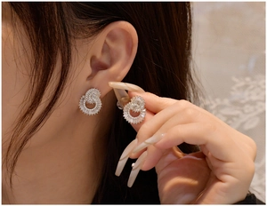 Macro shot of 925 sterling silver double circle earrings with sparkling cubic zirconia