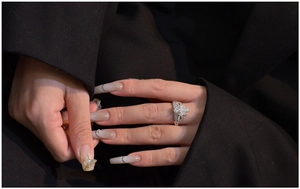 Detail of 925 sterling silver crown clover ring with marquise cut side stones on finger