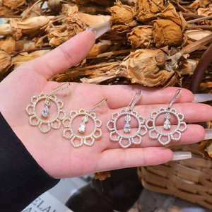 Irregular hollow sunflower drop earrings with full zircon inlay in gold and silver finish