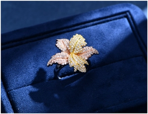 Macro detail of leaf-shaped S925 silver ring with tri-color plating and pavé cubic zirconia