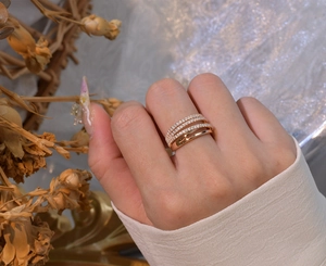 Detailed view of layered 18k rose gold plated silver ring with sparkling crystal rows