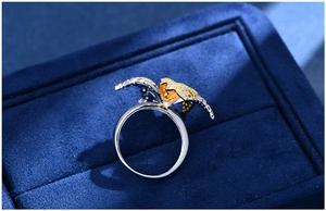 Macro shot of S925 silver petal ring with gold accents and sparkling micro-pave crystals