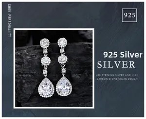 Macro shot of 925 silver pear cut drop earrings with sparkling pavé cubic zirconia