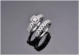 Macro shot of S925 silver double ring set with halo baguette and round pavé diamonds