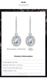Close-up of 925 silver earrings with 7x9mm oval cubic zirconia in prong setting