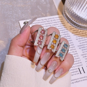 Adjustable silver bridge ring with sparkling rectangle row diamonds and colored gems