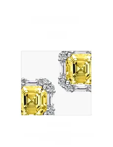 Macro shot of 925 silver earring with square yellow gemstone and micro-pave setting