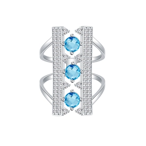 Modern 925 sterling silver bridge ring with light blue gemstones and diamond accents