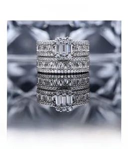 Detailed macro view of S925 silver rings with baguette-cut zircons and micro-pave setting