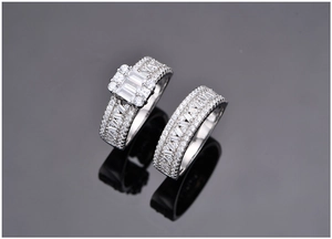 Macro detail of 925 silver wedding ring set featuring emerald cut zircon stones