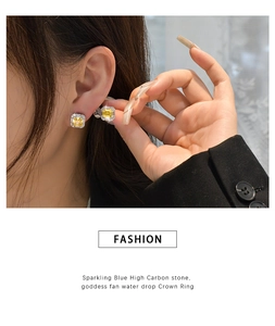 Macro detail of high carbon yellow diamond stud earrings with micro pavé setting
