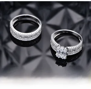Macro view of 925 silver rings with emerald cut cubic zirconia and micro-pave setting
