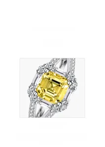 Detailed macro view of yellow Asscher cut gemstone ring with micro-pave setting