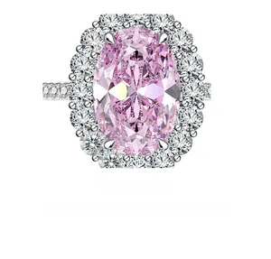 Macro shot of 5.6ct oval pink high carbon diamond ring with silver halo setting