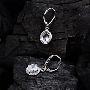 Classic 925 silver oval halo drop earrings with clear stones on charcoal background